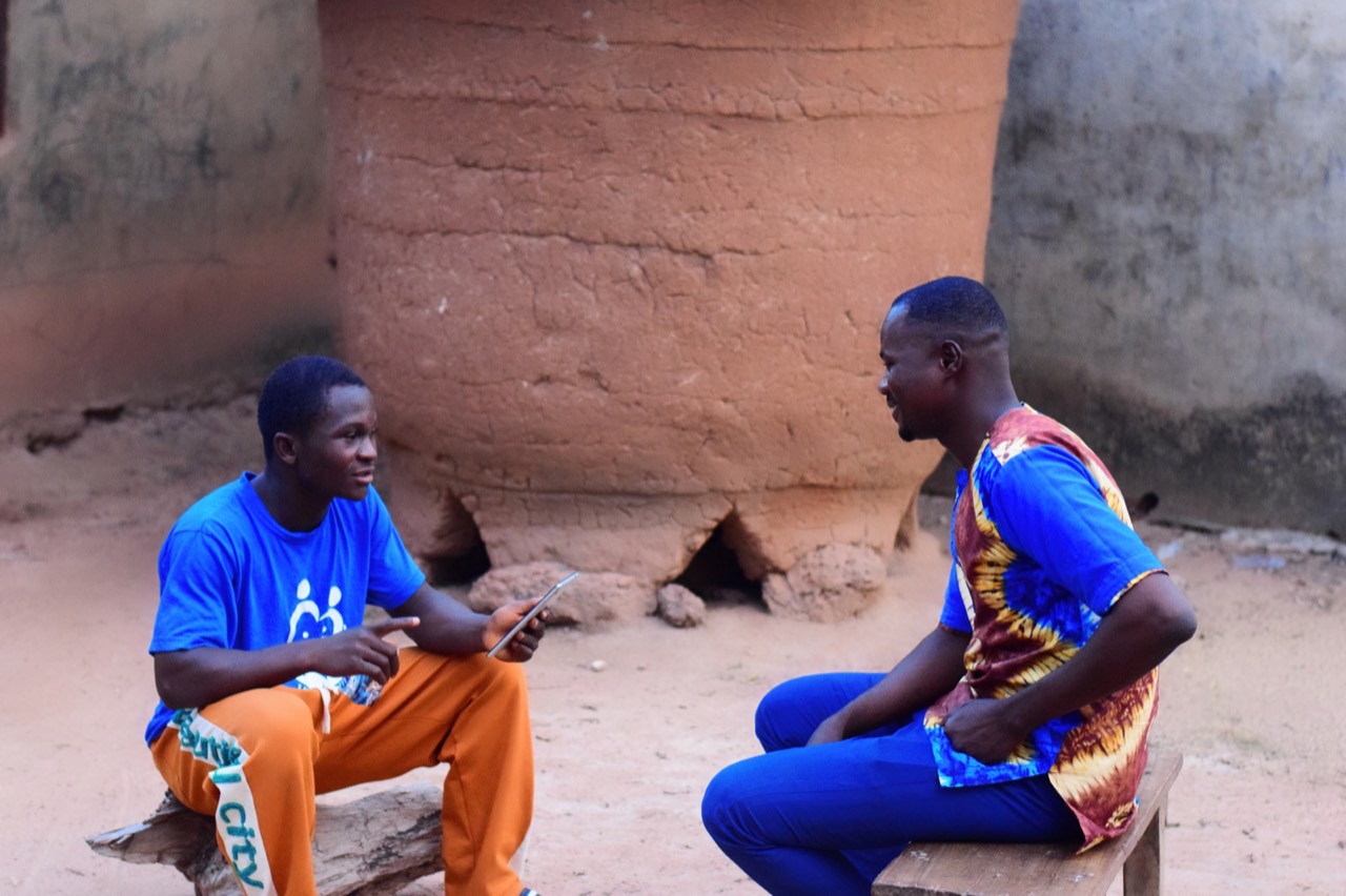 A Heartsmiles Consult enumerator conducting a community interview.