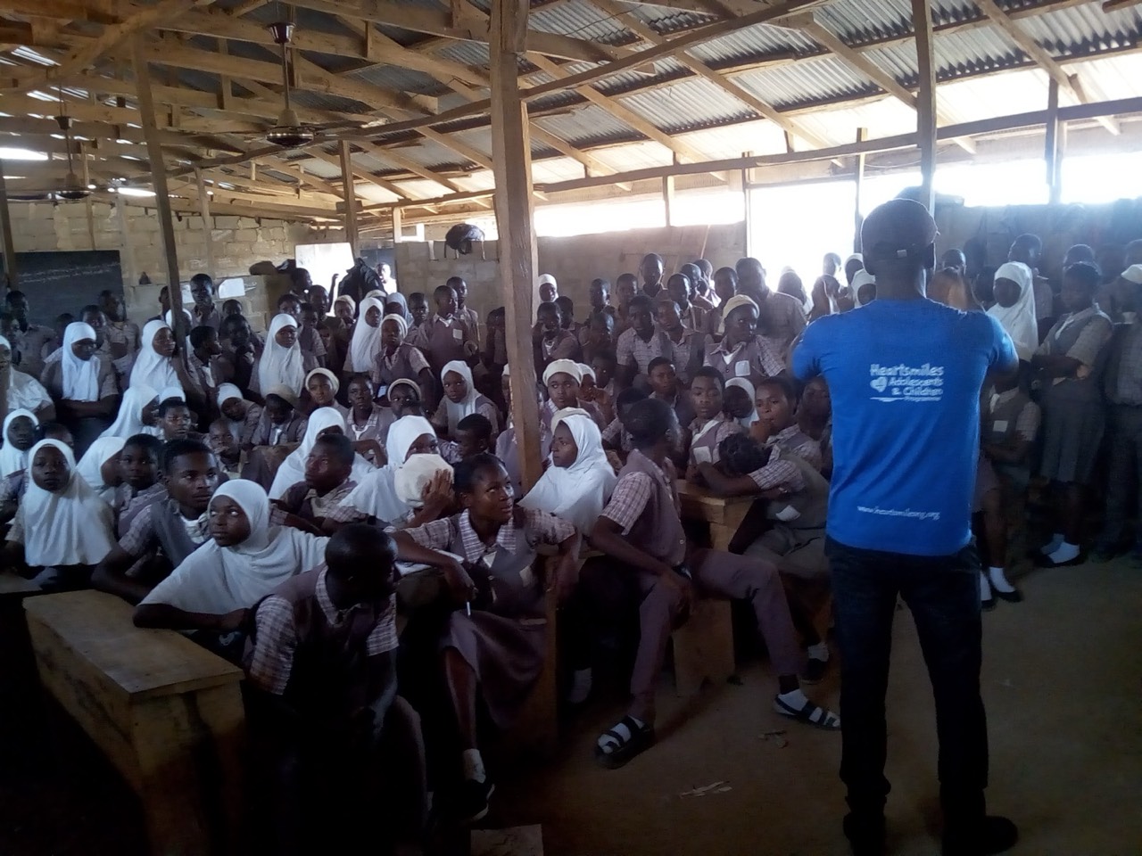 Addressing students during a school outreach program.